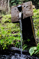 open faucet with water dripping