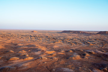 Golden deserts and hills at sunrise.