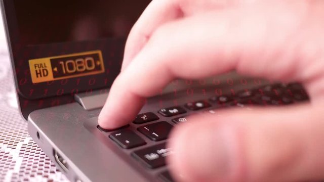 Finger Presses the Escape Button on HD Laptop with red binary overlay