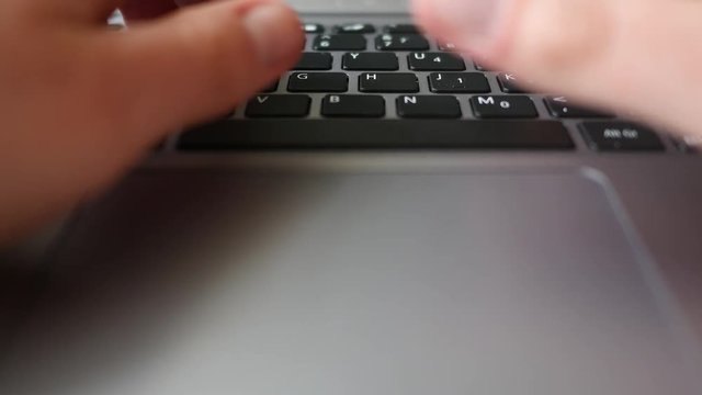 Finger dramatically presses the backspace button on laptop