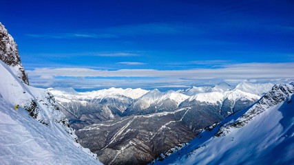 Aibga mountain peak covered by snow. Gorki Gorod ski resort. Sochi, Russia.