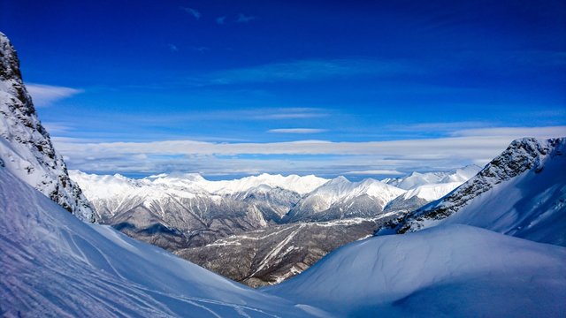 Aibga mountain peak covered by snow. Gorki Gorod ski resort. Sochi, Russia.