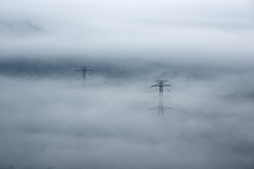 Electric transmission towers in fog