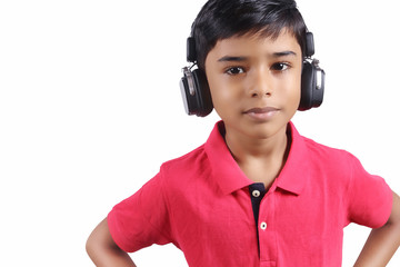 Indian young boy listen music with headphone