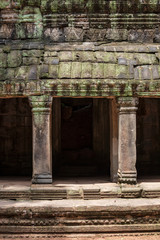 Fototapeta na wymiar Architectural symmetry at the Ta Prohm temple ruins in Siem Reap, Cambodia