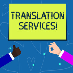 Conceptual hand writing showing Translation Services. Concept meaning organization that provide showing to translate speech Two Businessmen Hands Gesturing the Thumbs Up and Okay Sign