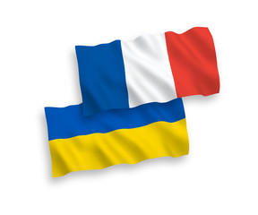 Fototapeta premium National vector fabric wave flags of France and Ukraine isolated on white background. 1 to 2 proportion.