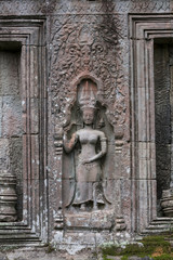 Beautiful sculpture at the Ta Prohm temple ruins in Siem Reap, Cambodia