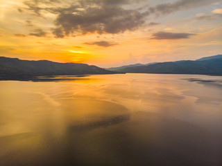 Fototapeta na wymiar Silhouette lake sunset with colourful sky cloud