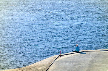 people walking along the promenade, Biking and scooters, watching the water flowing river or sea 