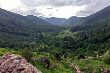 People traveling in the mountains on tourist routes in the summer.