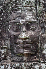 Beautiful face sculptures at the famous Bayon temple in the Angkor Thom temple complex, Siem Reap, Cambodia