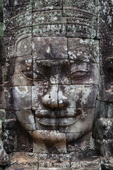 Fototapeta na wymiar Beautiful face sculptures at the famous Bayon temple in the Angkor Thom temple complex, Siem Reap, Cambodia