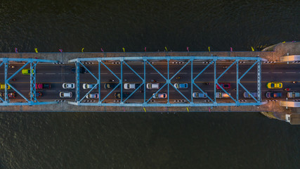 Aerial view on traffic bridge over river, cars on bridge