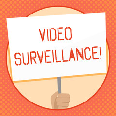 Writing note showing Video Surveillance. Business concept for system of monitoring activity in an area or building Hand Holding White Placard Supported for Social Awareness