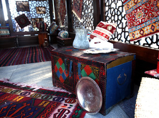 Traditional vintage chest,carpets and copper dishes