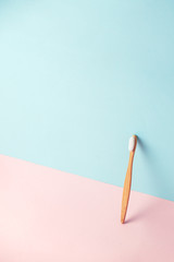 Bamboo teeth brush on minimalistic backgroud. zero waste concept, 3d rendering imitation background, eco friendly modern creative idea, copy space