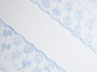 Blue lace on diagonal on a white background