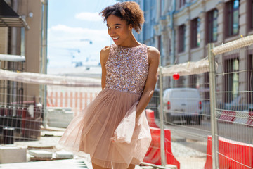 Portrait of an African model woman in pink dress