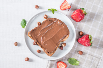 Sweet sandwich with chocolate and strawberries