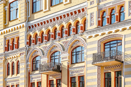 Elements of the facade of the house of a century ago with incredibly beautifully decorated and bright walls.