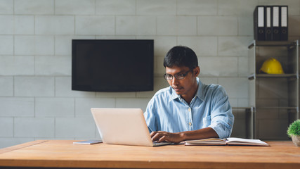 Businessman sitting at his desk in the office