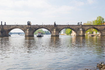 Fototapeta na wymiar City Prague, Czech Republic. View to the river and bridge from river Vltava. Spring. 2019. 24. April. Travel photo.