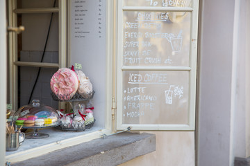 City Prague, Czech Republic. Outdoor cafe, cakes on the window and choice. April 24. 2019