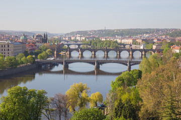 Fototapeta na wymiar City Prague, Czech Republic. View from the mountain to the river and bridges. Spring. 2019. 24. April.