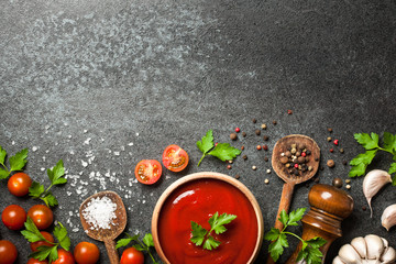 Cooking background with spices, tomatoes and sauce