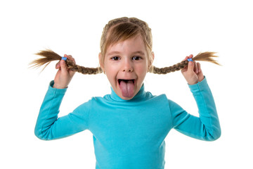 Cheerful girl making funny face. Portrait of emotionally kid. Funny little girl isolated on white background. Beautiful caucasian model with two braids