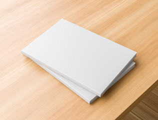 Realistic hardcover book or catalogue mock up on wooden table. White hardcover book on wooden...