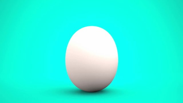 Hatching egg of white eggshell splitting after swaying, isolated on blue green background. Hope coming out concept.