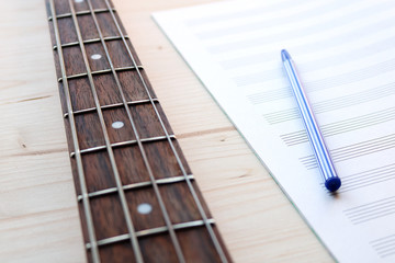 Fototapeta premium bass guitar and notepad