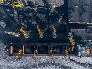 Industrial photo, Loading coal mining in port ship with crane. Aerial top view