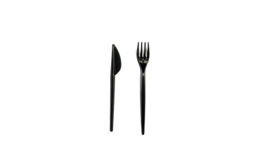 Black Disposable plastic tableware and appliances for food on a white background. Fork and knife. Concept plastic, harmful, environmental pollution, stop plastic. Flat lay, top view.