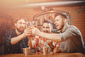 Funny old friends gathered in bar for beer, clink glasses
