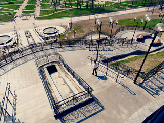 MOGILEV, BELARUS - APRIL 27, 2019: park area with a staircase and a fountain.