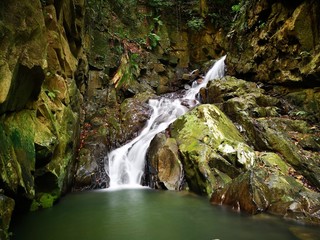 The beautiful silky smooth waterfall stream in the jungle of Borneo rainforest Sabah.