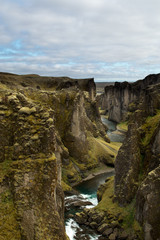 Fototapeta na wymiar Fjaðrárgljúfur or Fjadrargljufur is a magnificent and massive canyon in Iceland