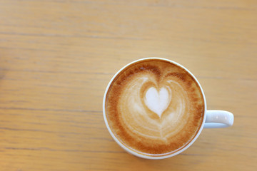hot latte coffee drink put on wooden table in cafe restaurant