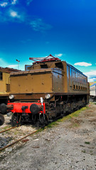 Fototapeta na wymiar old brown train in a station