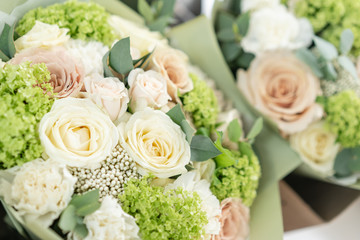 Two Beautiful bouquets of mixed flowers. the work of the florist at a flower shop. Delicate Pastel color. Fresh cut flower. Green and pink color