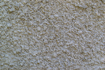 The texture of the concrete wall. A raw plaster wall background