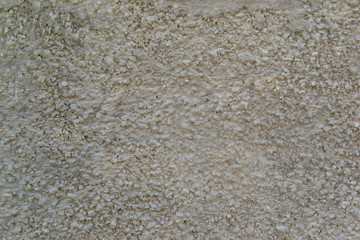 The texture of the concrete wall. A raw plaster wall background
