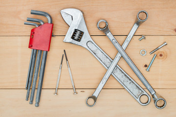 Set of tool construction on wooden background - top view.
