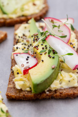 Sandwiches with cream cheese, vegetables and salami.