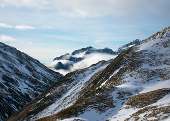 Beautiful scene of clody and snowy mountains.