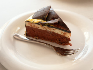 cake on a saucer on the table.