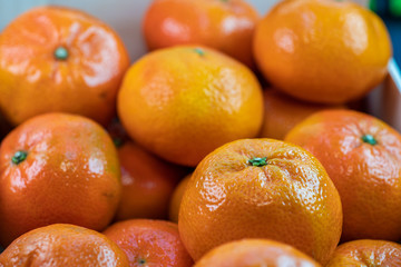 Background of many fresh tangerines.